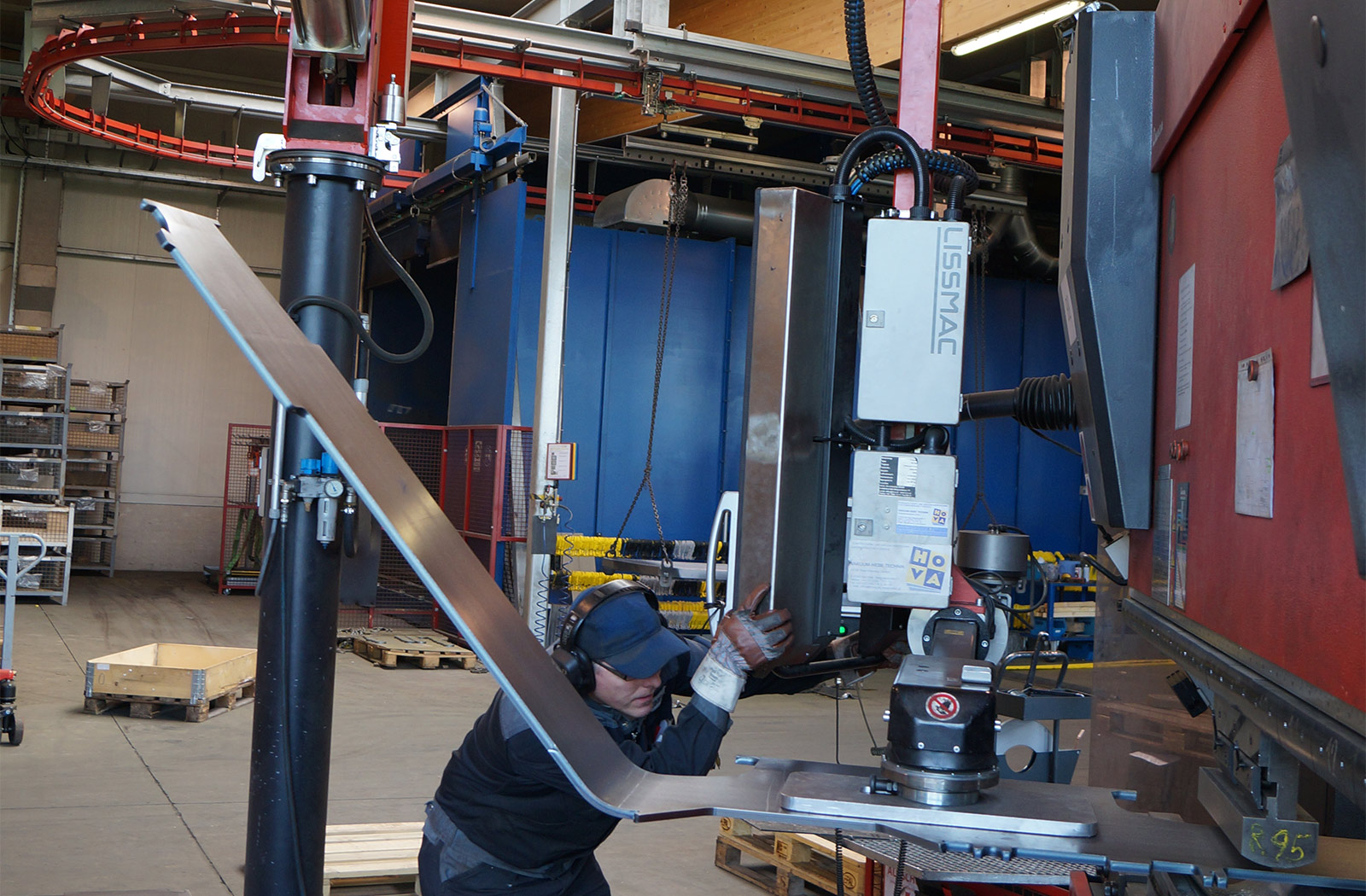 Handling of sheets at a press brake